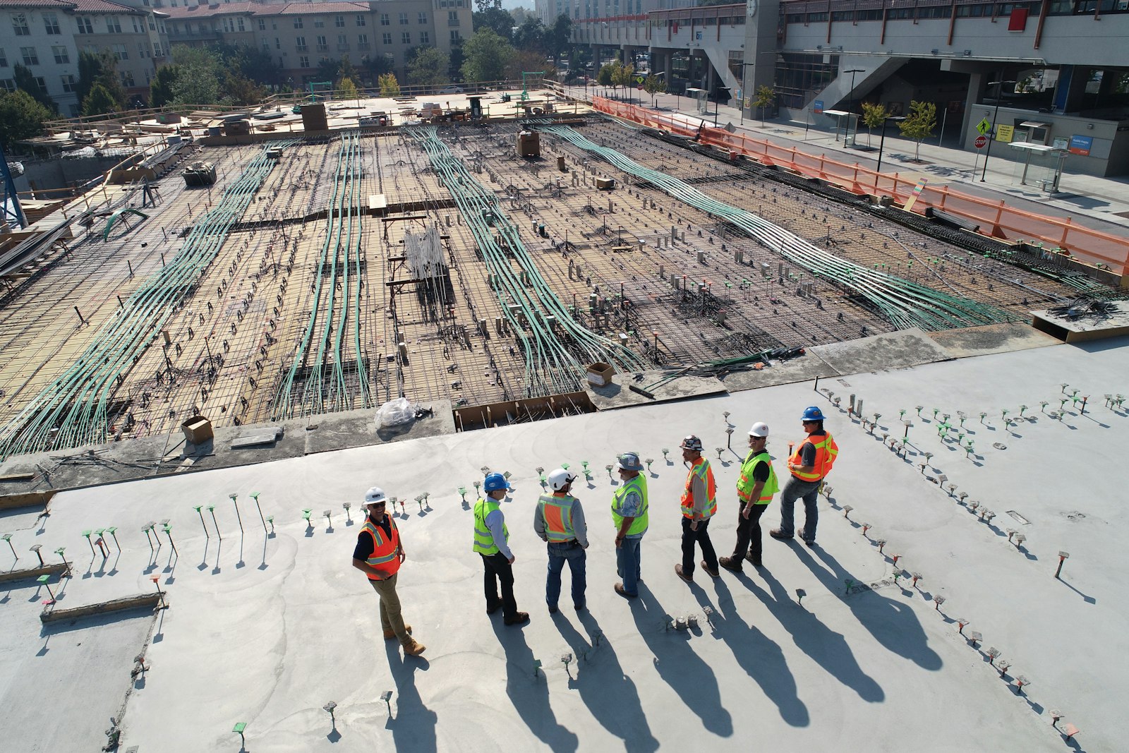Drywall Supreme crew reviewing a multifamily construction deck