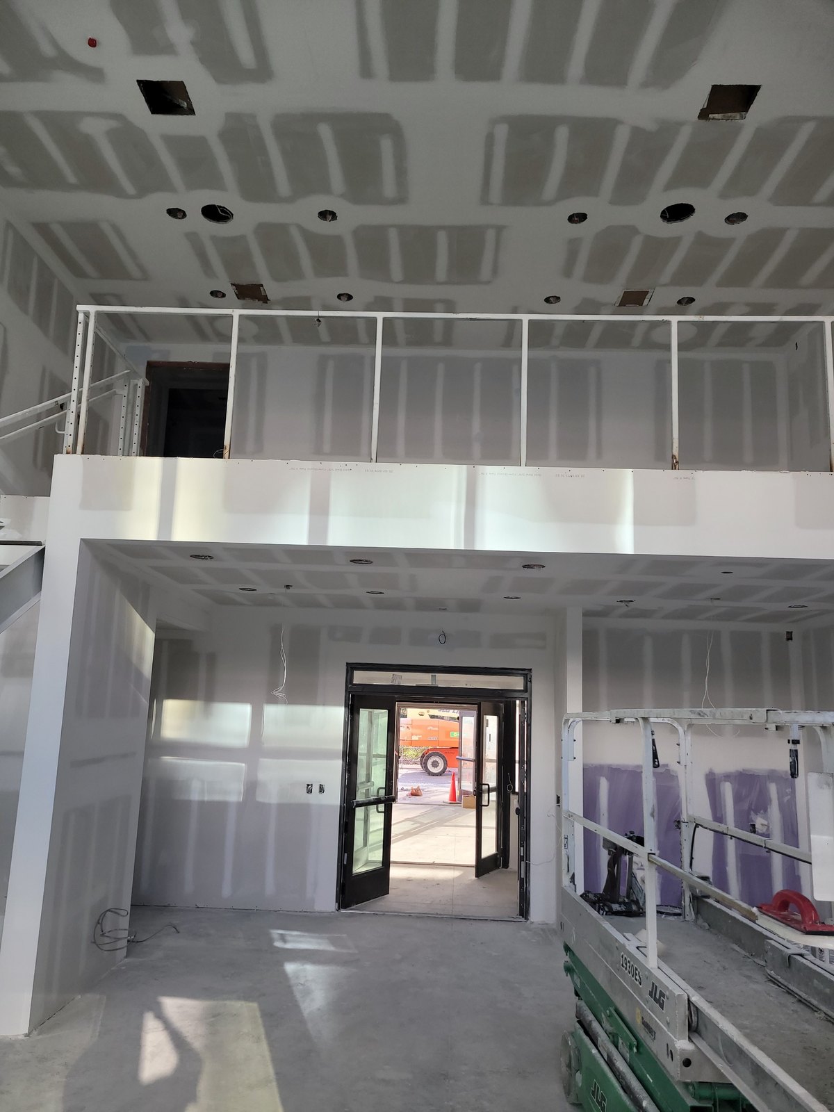 Finished drywall atrium — taped ceiling and walls by Drywall Supreme