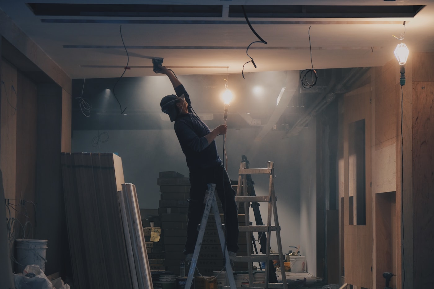 Drywall Supreme finisher working a ceiling on a job site