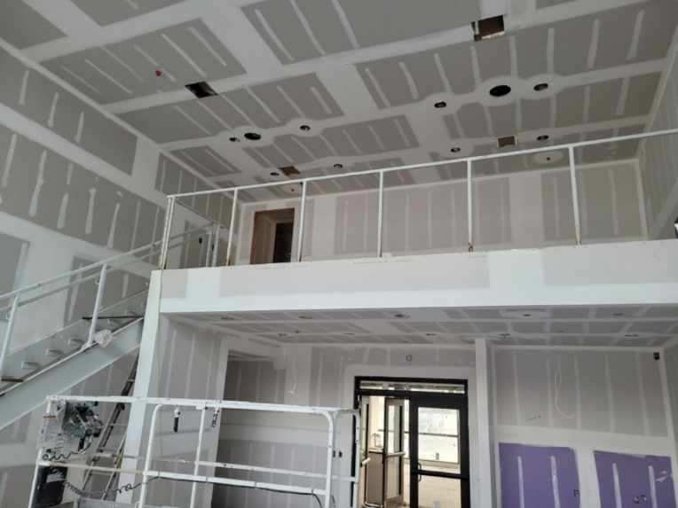 Two-story lobby hung, taped, and finished by Drywall Supreme crews
